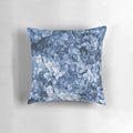 Vibrant blue hydrangea flowers in an oil painting-inspired design on a decorative pillow.