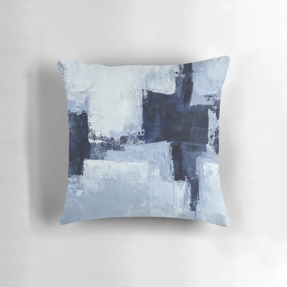 A set of two blue and navy abstract art pillows with a modern, minimalist design.