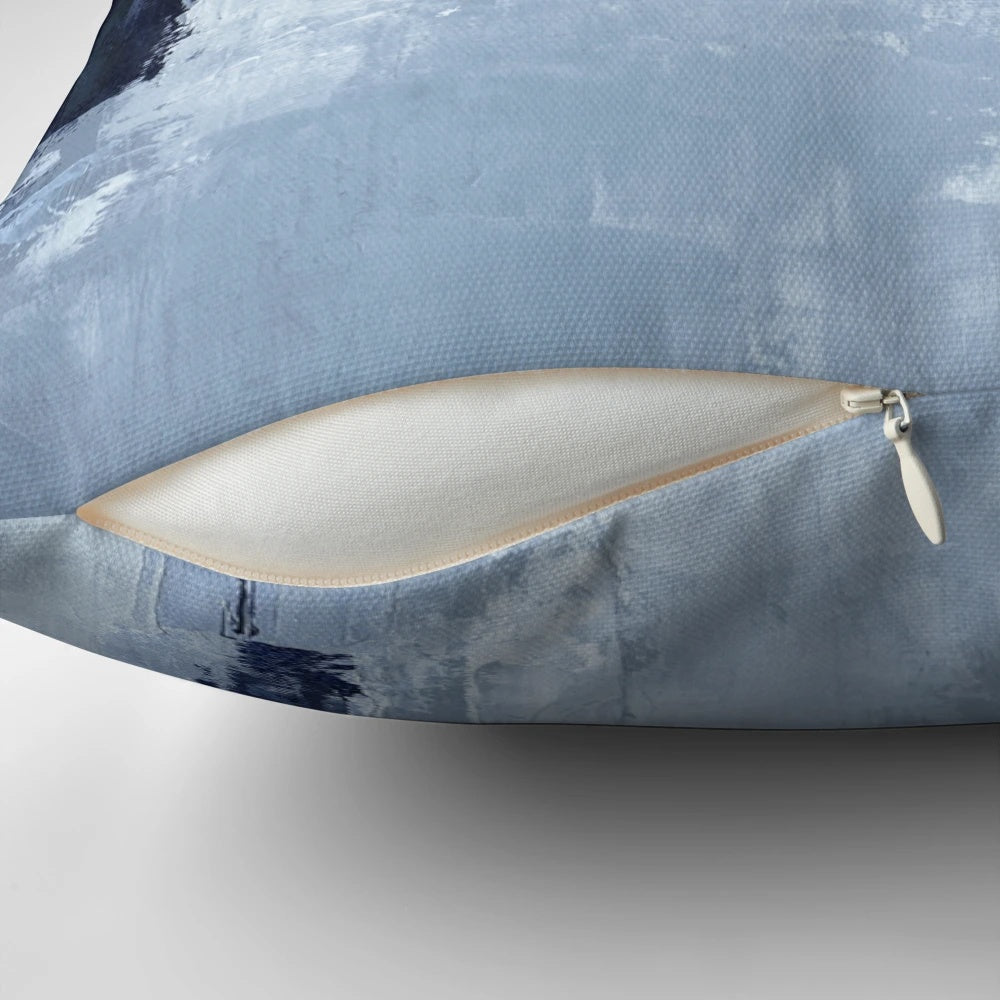 A set of two blue and navy abstract art pillows with a modern, minimalist design.