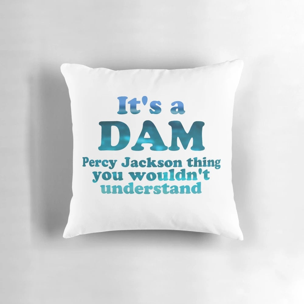 Blue writing pillow with "It's a Dam Percy Jackson Thing" text, inspired by the Percy Jackson book series.
