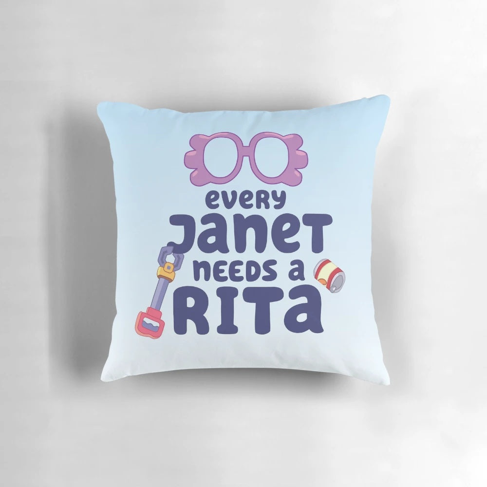 "Colorful 'Every Janet Needs a Rita' pillow featuring characters from the popular Bluey cartoon series"