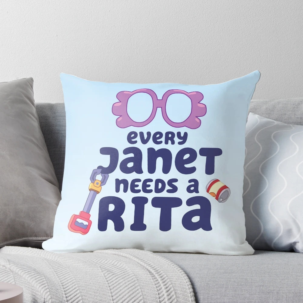 "Colorful 'Every Janet Needs a Rita' pillow featuring characters from the popular Bluey cartoon series"