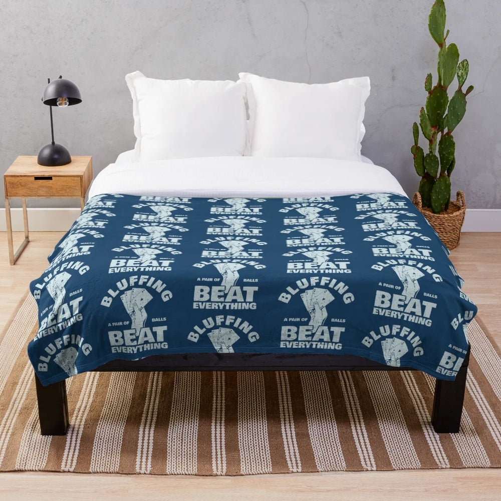 Plush blanket with "Bluffing Beats Everything" text and poker-themed design