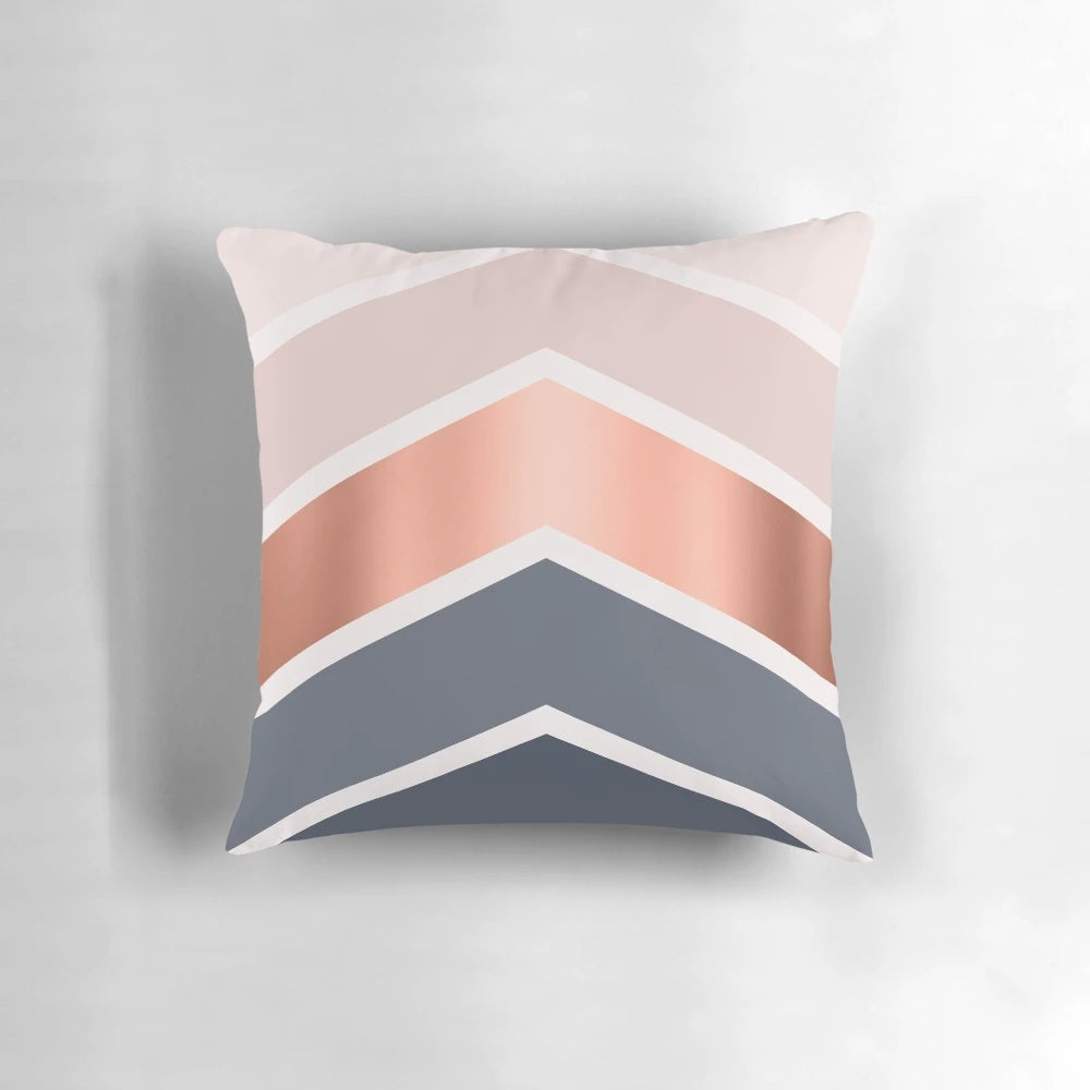 Chevron pattern pillow in blush, navy blue, and copper colors