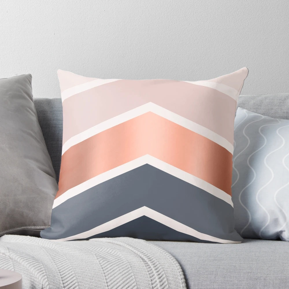 Chevron pattern pillow in blush, navy blue, and copper colors