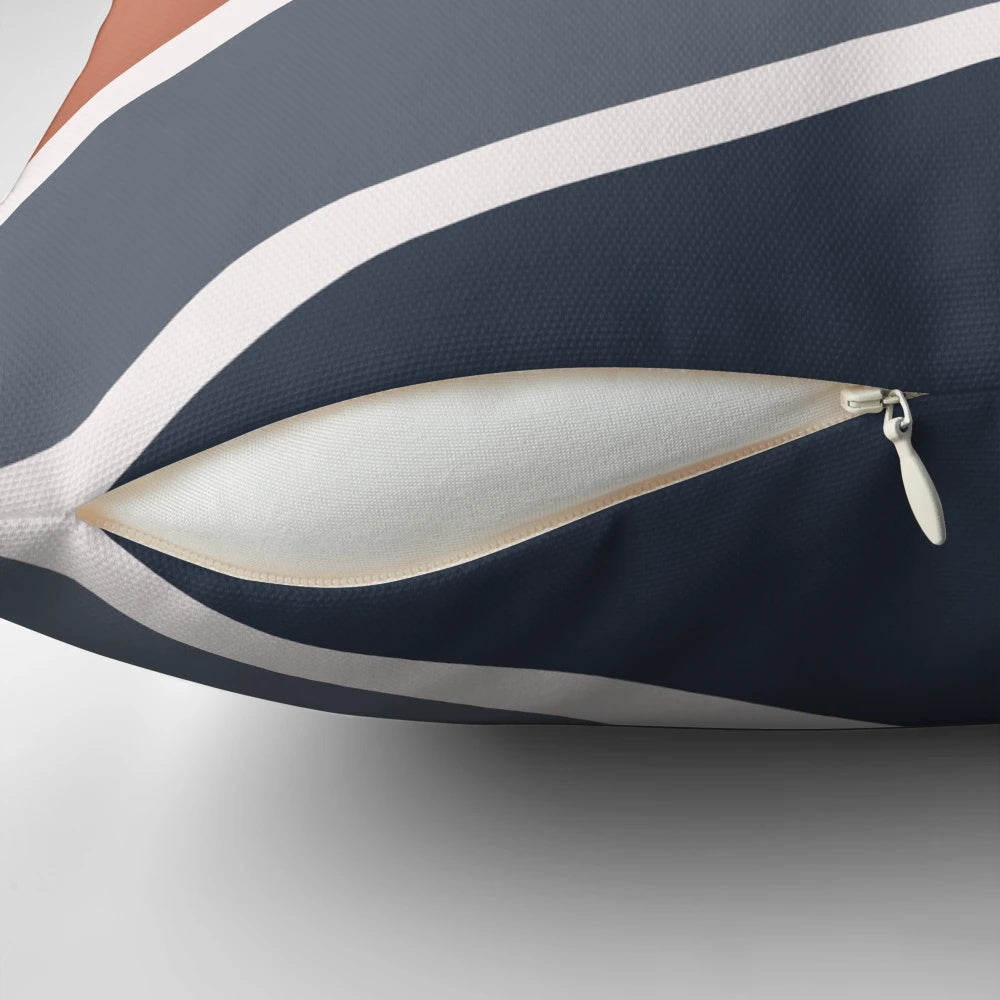 Chevron pattern pillow in blush, navy blue, and copper colors