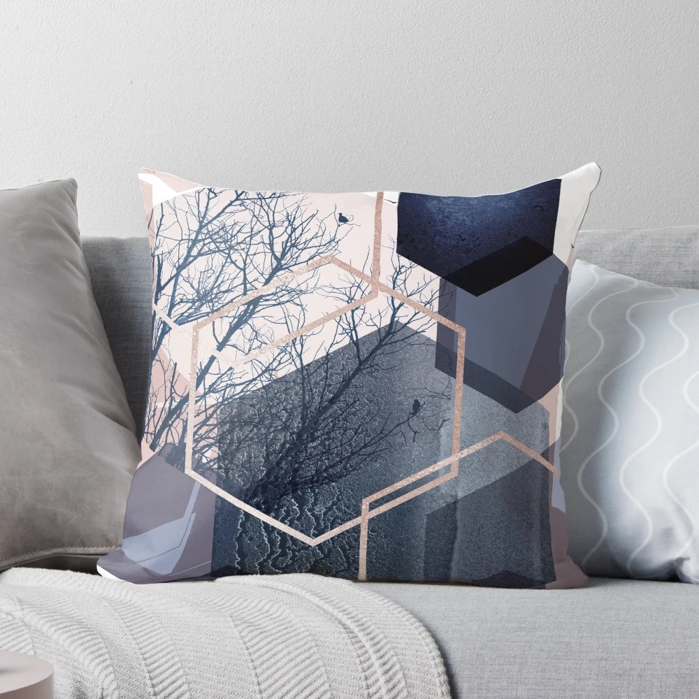 Abstract landscape pillow featuring a modern hexagon pattern in soft pastel shades of blush pink and navy blue.