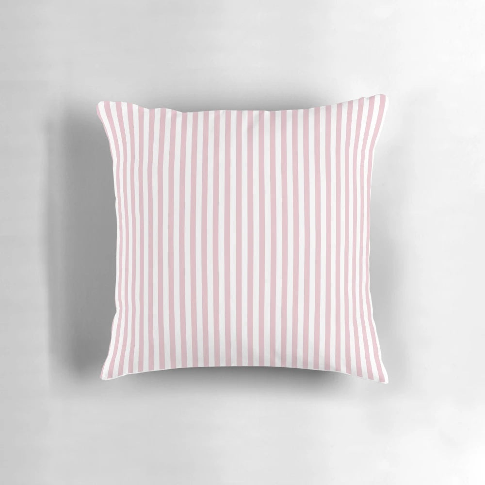 A decorative pillow with blush pink and white vertical stripes.