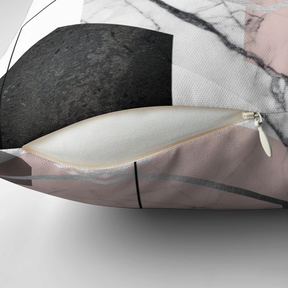 Blush pink and grey scandinavian geometric throw pillow with a minimalist textured triangle design