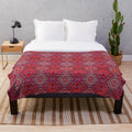 Vintage-inspired geometric pattern plush blanket in pink and white