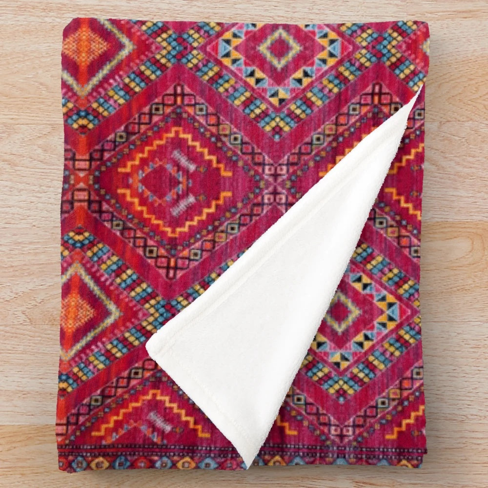 Vintage-inspired geometric pattern plush blanket in pink and white
