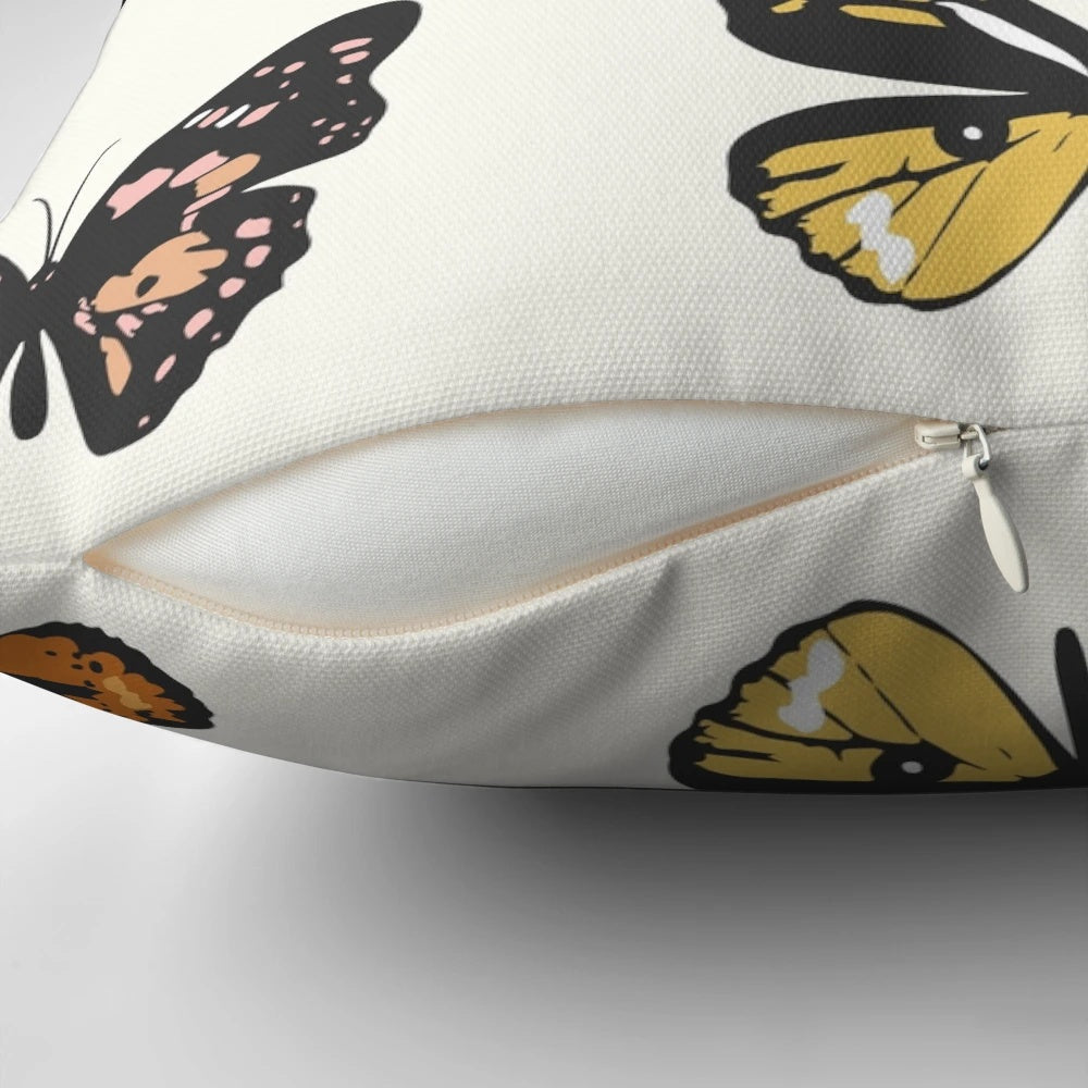 A soft, plush pillow featuring a colorful butterfly sticker pattern in pastel shades of pink, yellow, and mustard.