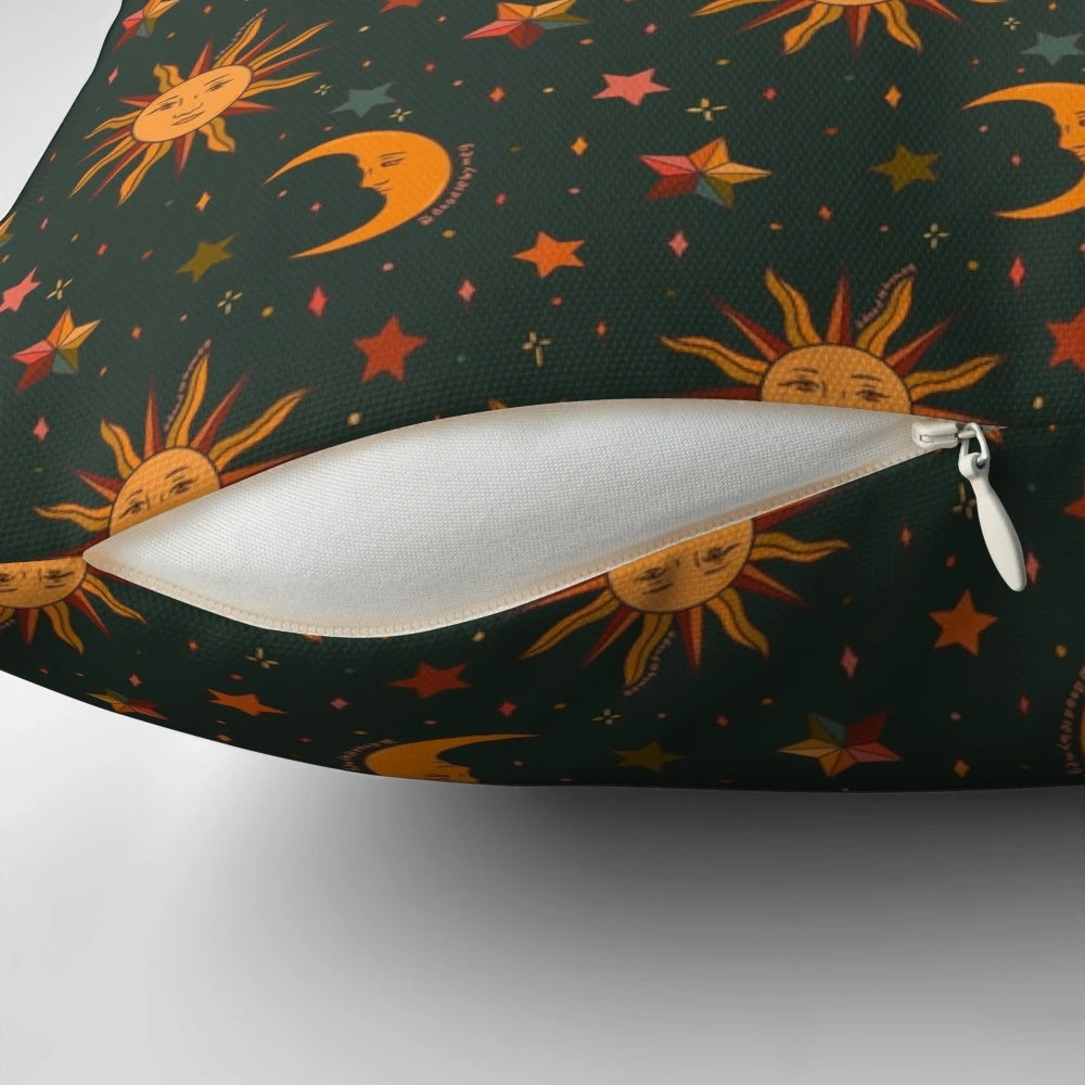 Teal pillow with a folk moon and star pattern, perfect for a boho, witchy, or astrology-inspired space.