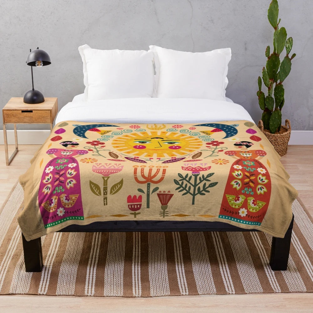 Colorful Frida Kahlo inspired plush blanket with floral and folk art designs