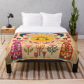 Colorful Frida Kahlo inspired plush blanket with floral and folk art designs