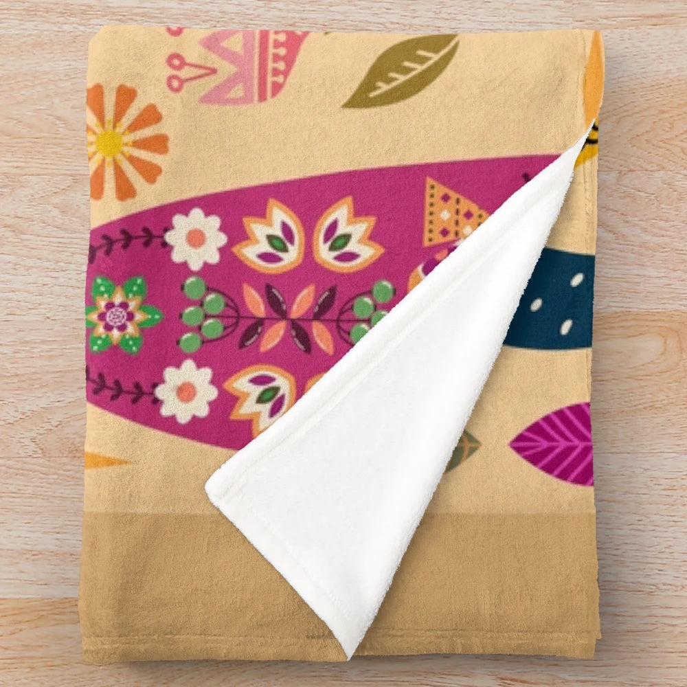 Colorful Frida Kahlo inspired plush blanket with floral and folk art designs