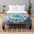 Soft and cozy boho mandala plush blanket in shades of blue and white