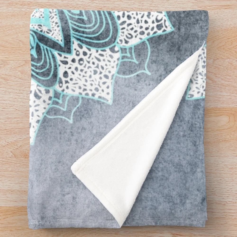 Soft and cozy boho mandala plush blanket in shades of blue and white