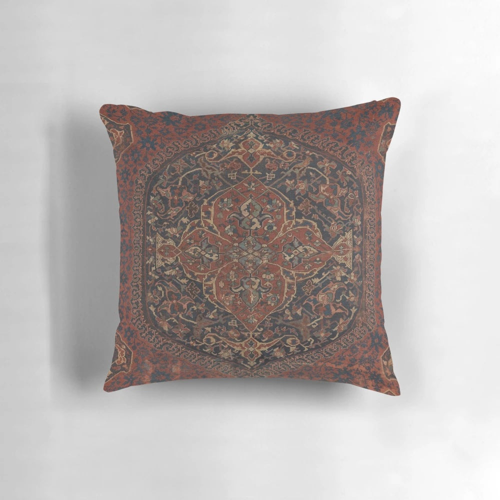 Boho chic vintage style medallion rug pattern decorative accent pillow in red, blue, green, and brown colors.