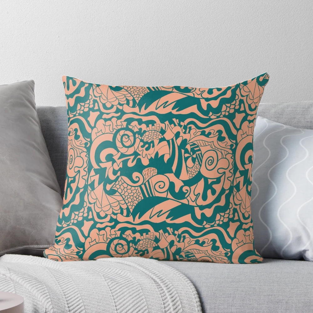 Whimsical doodle pattern pillow in teal, green, and tan colors for a boho-inspired home