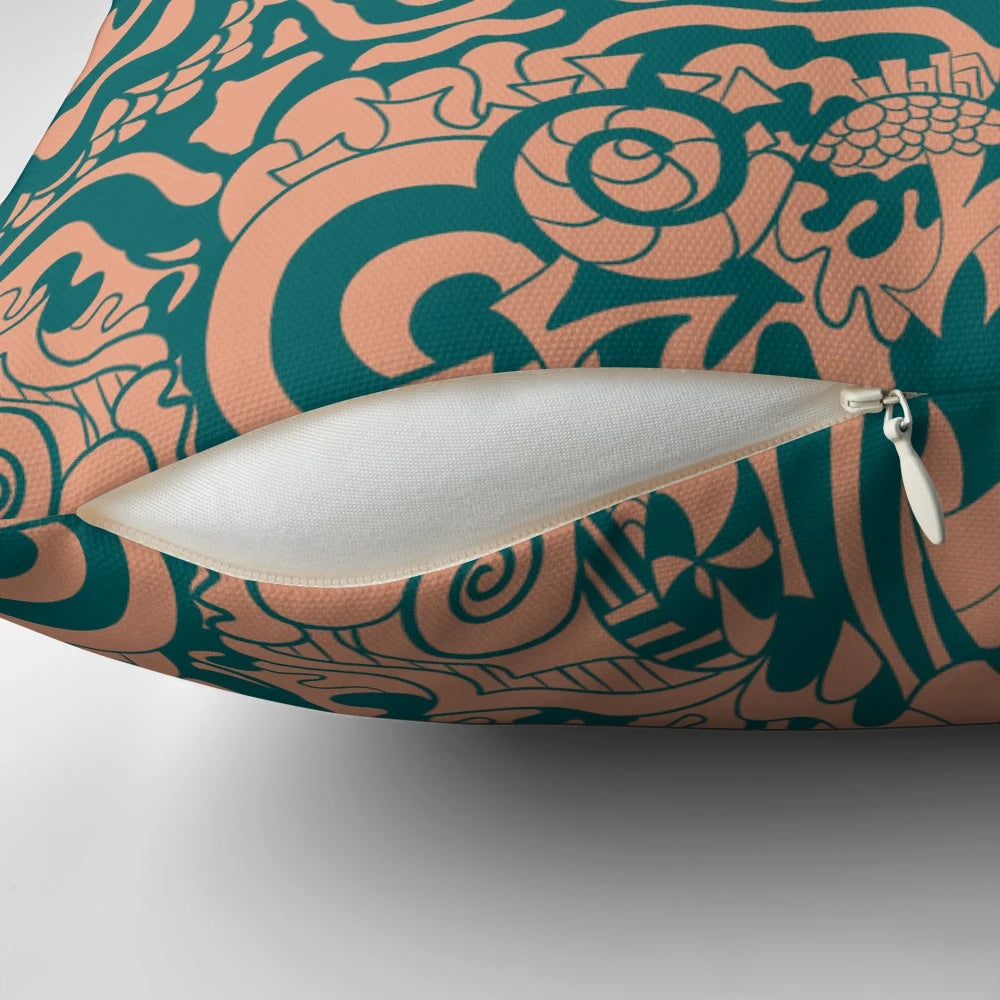Whimsical doodle pattern pillow in teal, green, and tan colors for a boho-inspired home