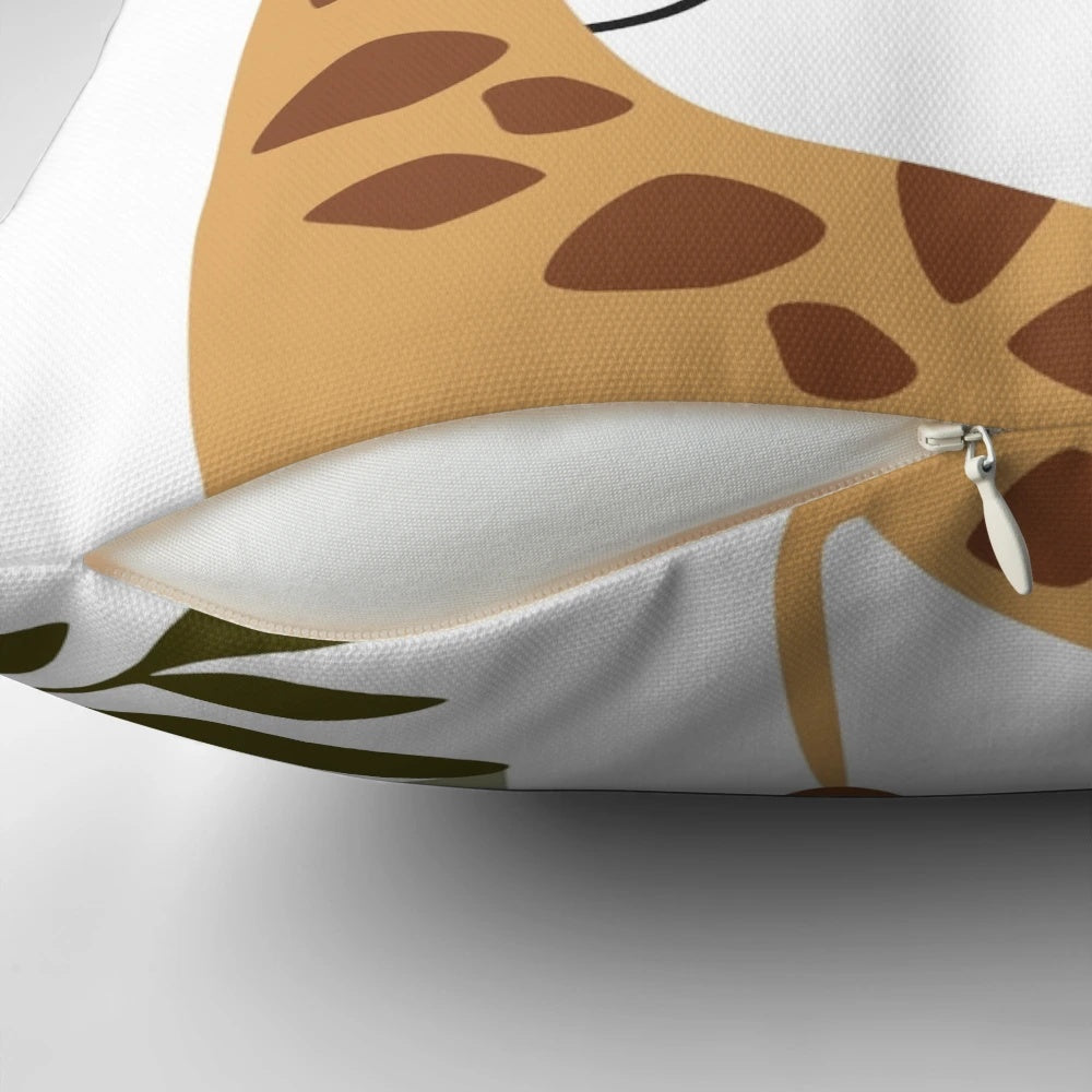 Boho-style pillow featuring a cute giraffe surrounded by jungle leaves and the sun
