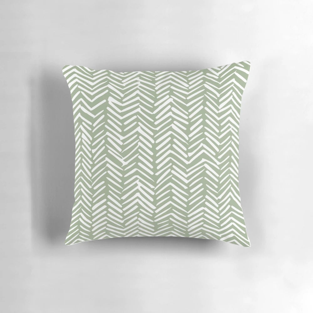 Boho herringbone pattern pillow in sage green and white colors