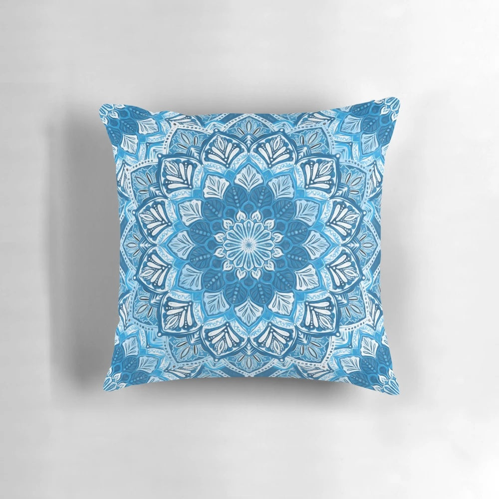 Boho mandala pattern decorative pillow in blue and white colors