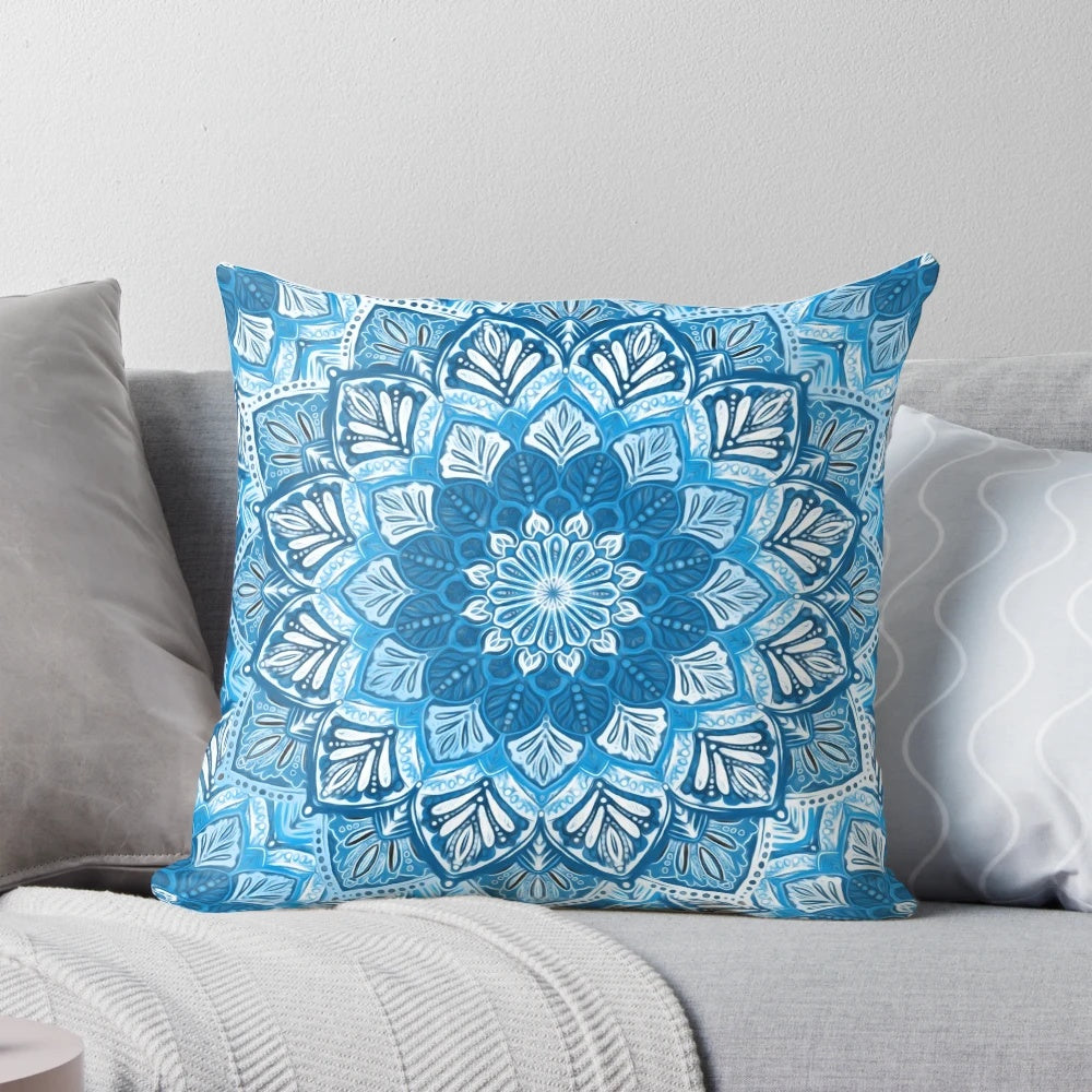 Boho mandala pattern decorative pillow in blue and white colors