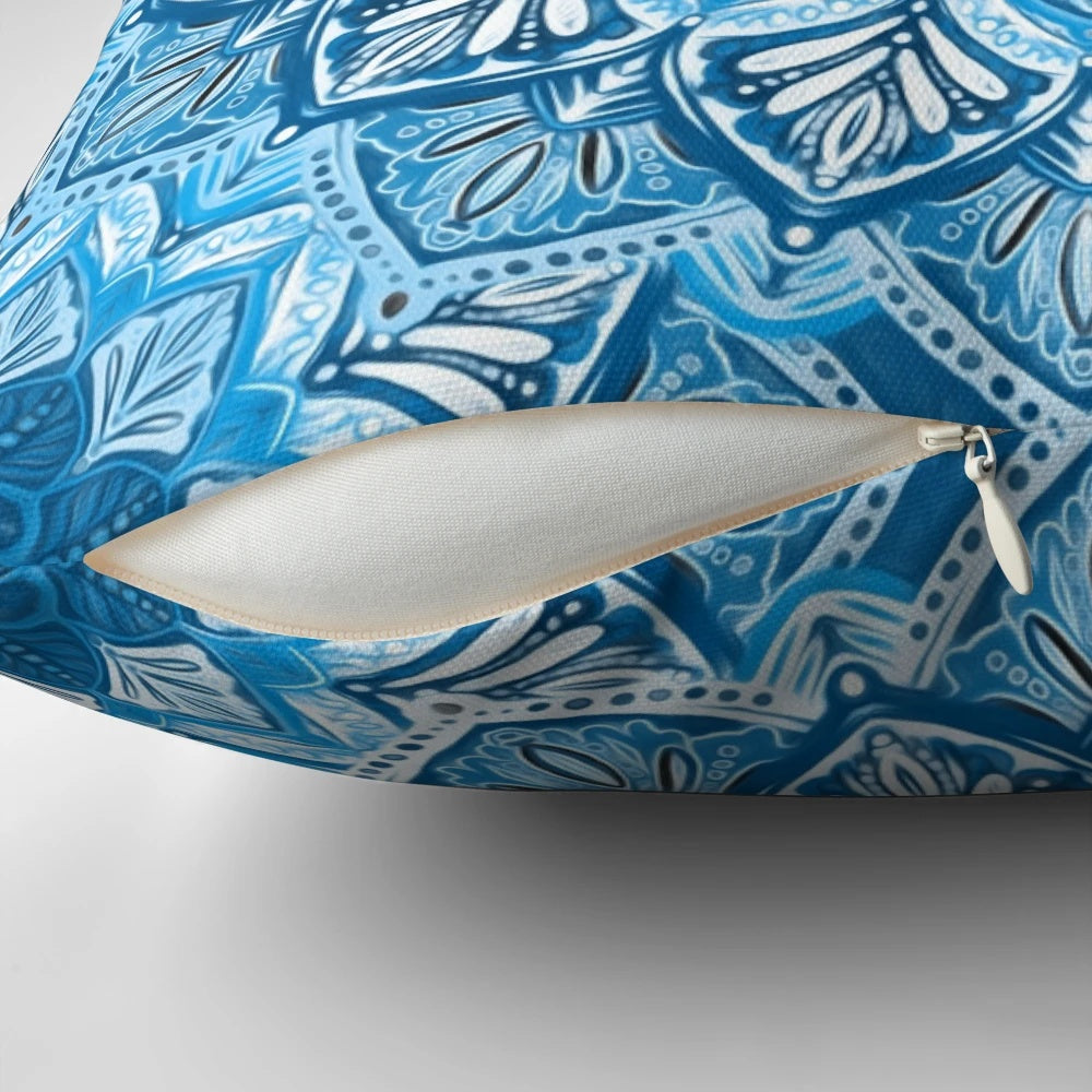 Boho mandala pattern decorative pillow in blue and white colors