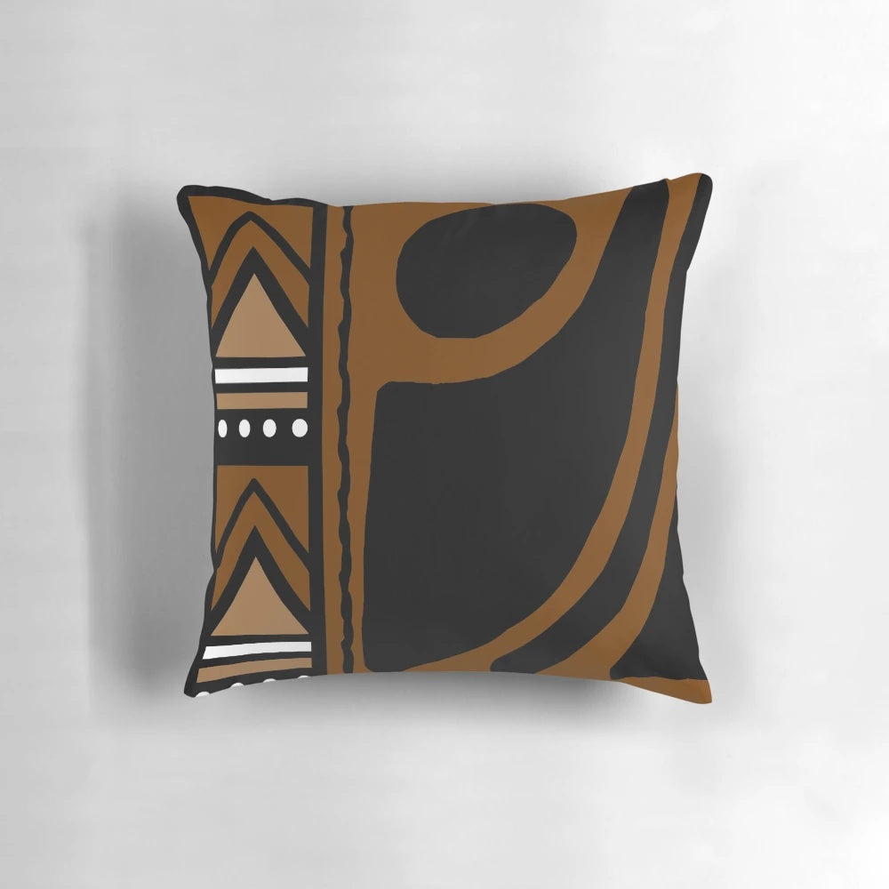 A modern throw pillow featuring an abstract African tribal mud cloth pattern in earth tones.
