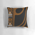 A modern throw pillow featuring an abstract African tribal mud cloth pattern in earth tones.