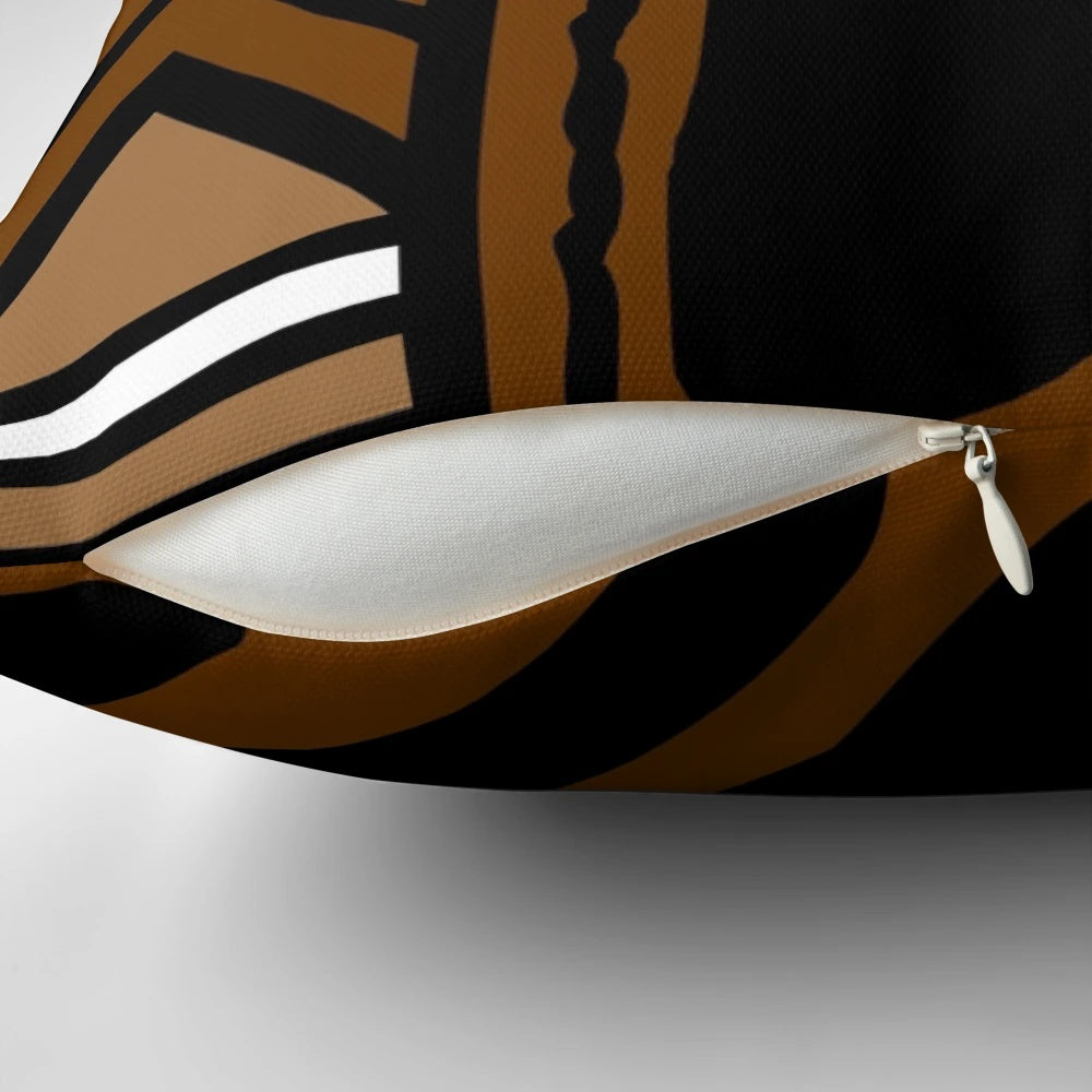 A modern throw pillow featuring an abstract African tribal mud cloth pattern in earth tones.