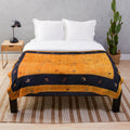 Moroccan-style plush blanket with traditional artwork and bohemian design
