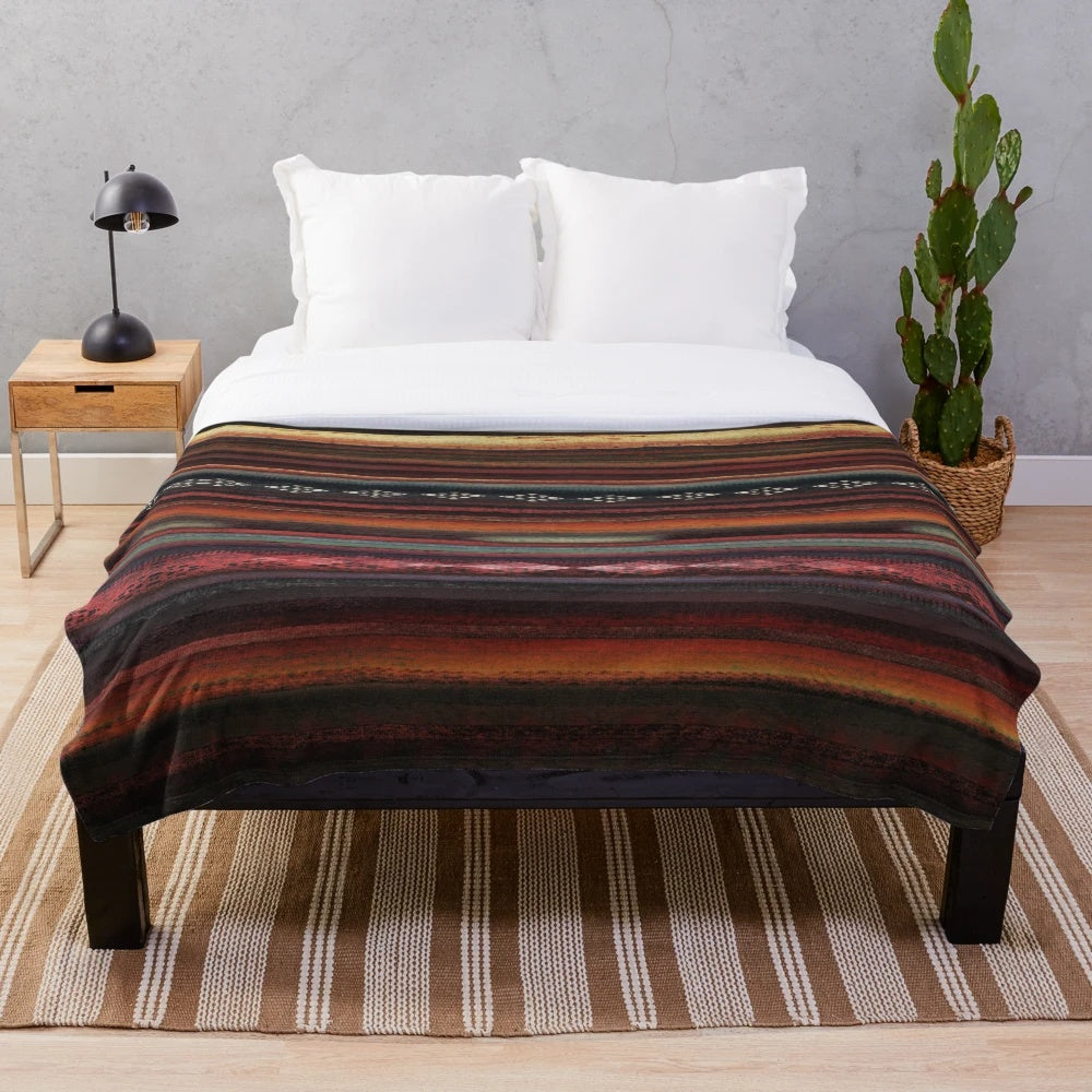 Plush boho-style blanket with native american inspired geometric patterns