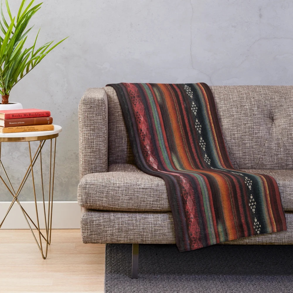 Plush boho-style blanket with native american inspired geometric patterns