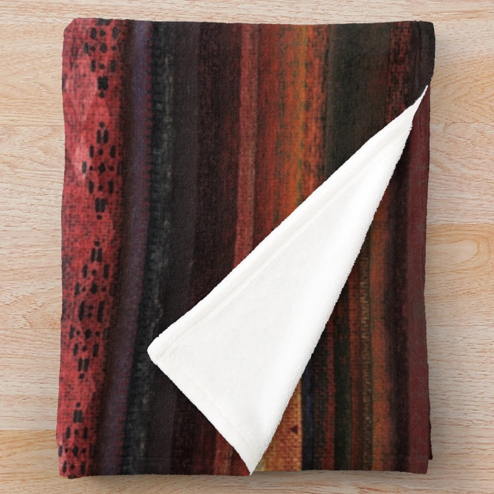 Plush boho-style blanket with native american inspired geometric patterns