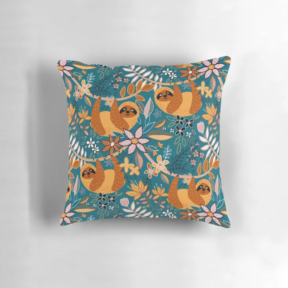 Boho sloth floral decorative pillow with teal, orange, brown, and blush colors