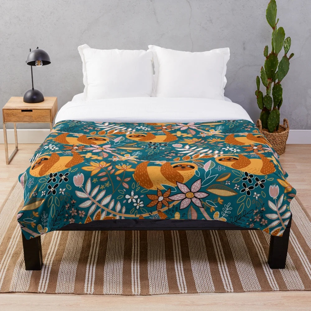 Boho sloth floral plush blanket with teal and orange pattern