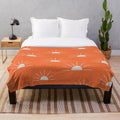 Boho sun pattern orange plush blanket with abstract sun silhouette design