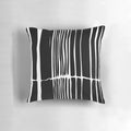 Abstract black and white striped pillow with a bold, linear pattern for modern, minimalist home decor.