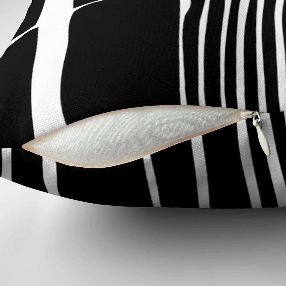 Abstract black and white striped pillow with a bold, linear pattern for modern, minimalist home decor.