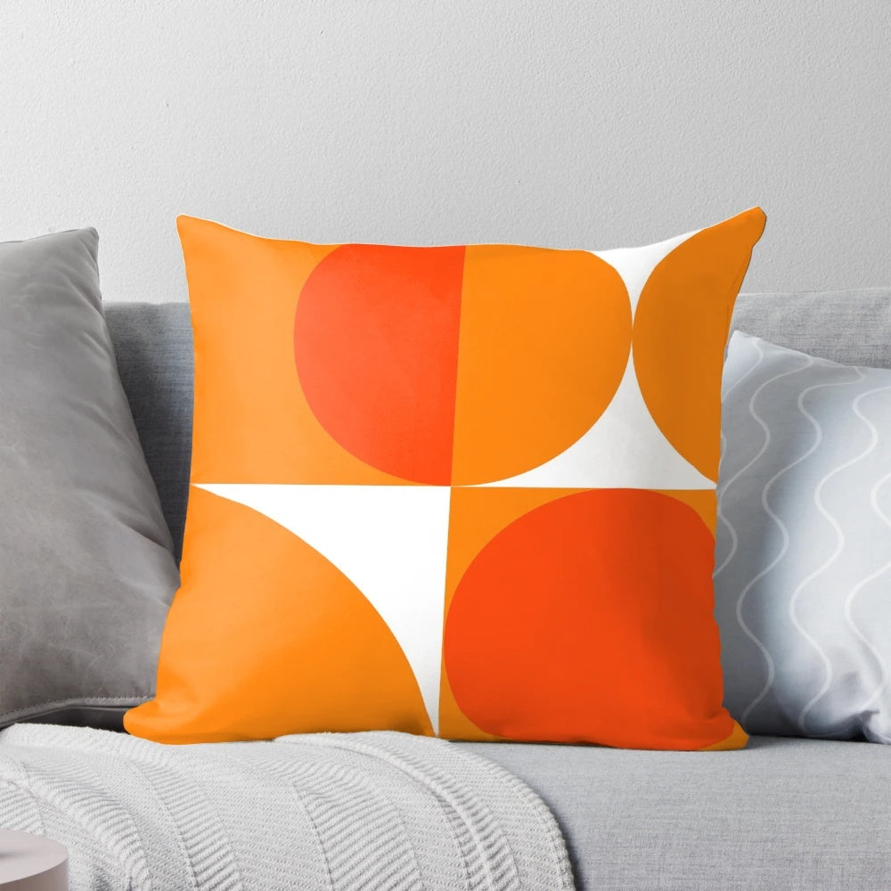 Orange and geometric pillow design inspired by the Bauhaus movement