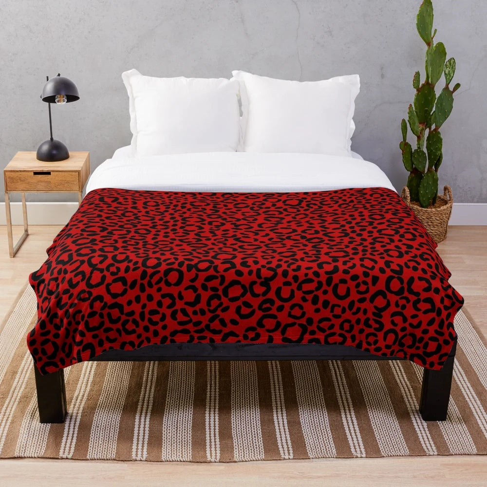 Leopard print plush blanket with bold red and black design