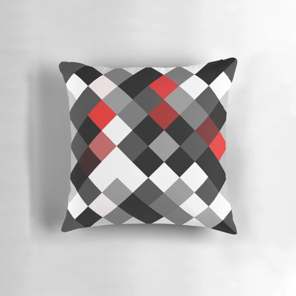 Bold black, white, and red diagonal patterned throw pillow for modern interior design