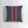 Navy blue and red striped throw pillow with bold vertical stripes