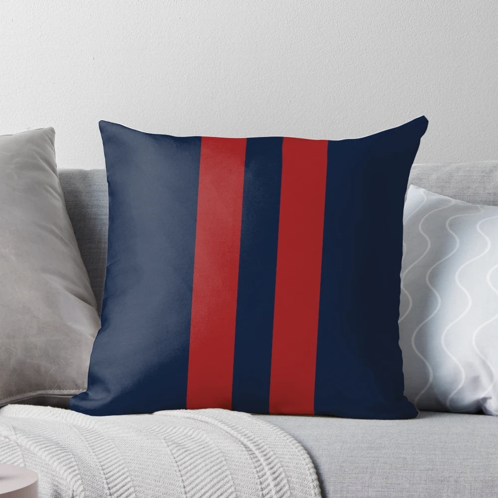 Navy blue and red striped throw pillow with bold vertical stripes