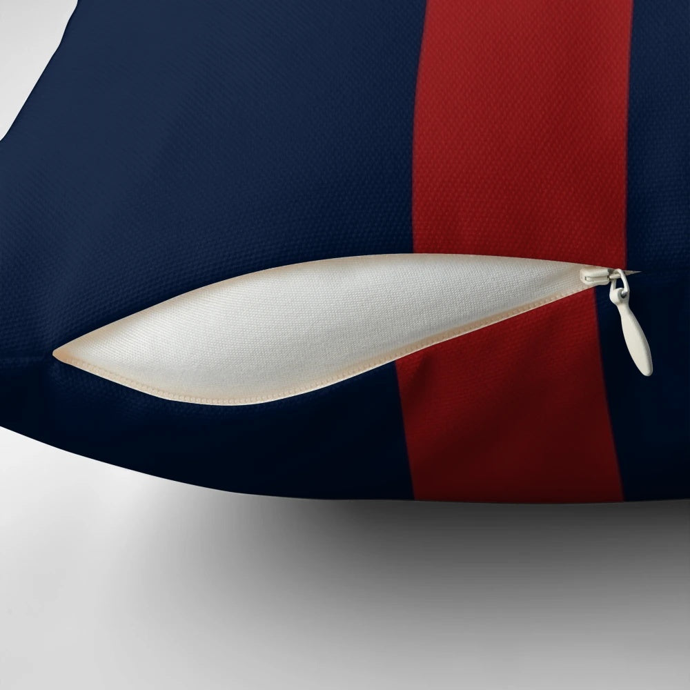 Navy blue and red striped throw pillow with bold vertical stripes