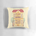 A decorative pillow with the words "Lived in Books" hand-lettered on a book-themed background, perfect for bookworms and readers.