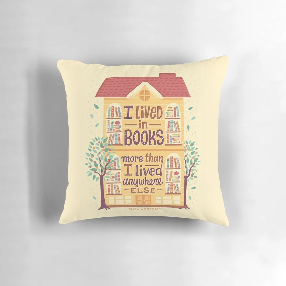 A decorative pillow with the words "Lived in Books" hand-lettered on a book-themed background, perfect for bookworms and readers.
